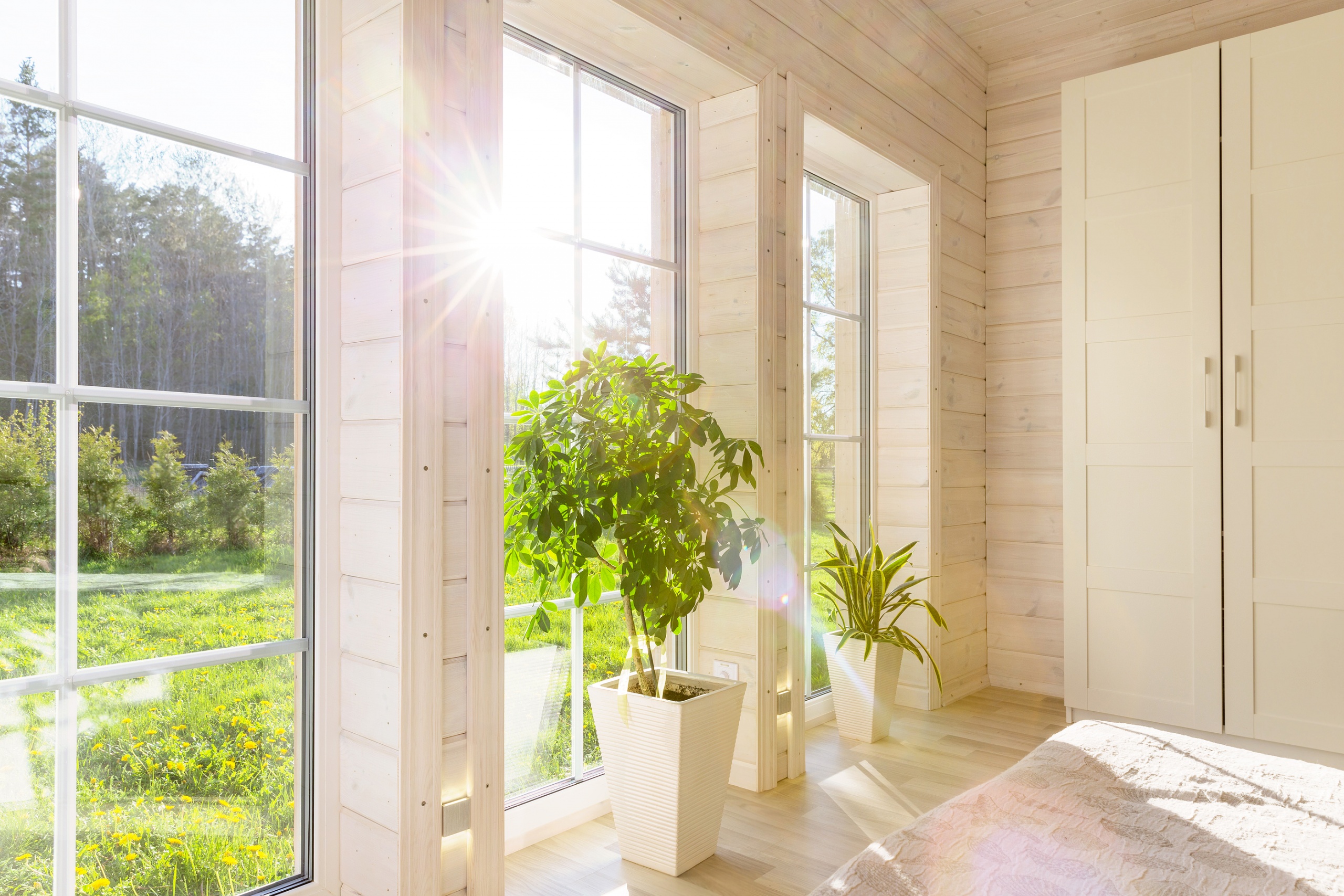 Bright-Photo-Studio-Interior-With-Big-Window-High-Ceiling-White-Wooden-Floor